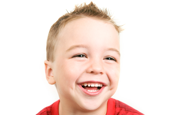 A boy smiling at South Wales based dental practice, Newland and Associates